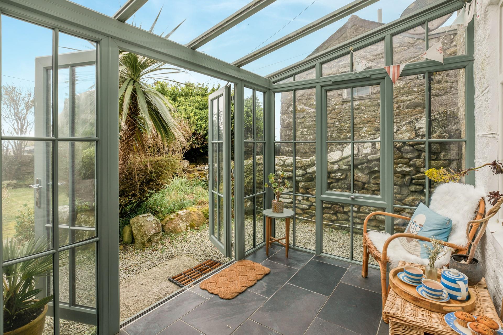 The sunroom is the ideal spot to sit and enjoy a quiet cuppa.