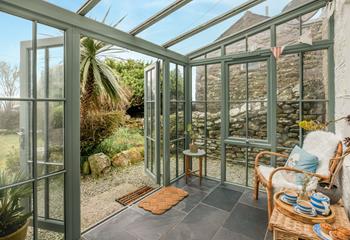 The sunroom is the ideal spot to sit and enjoy a quiet cuppa.