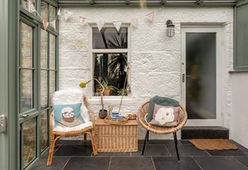 Enjoy tea and cake in the sunroom after a morning stroll around the village.