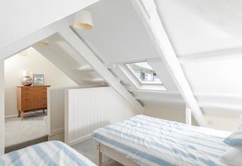 Bedroom 3 is located upstairs and has beautiful sea views.