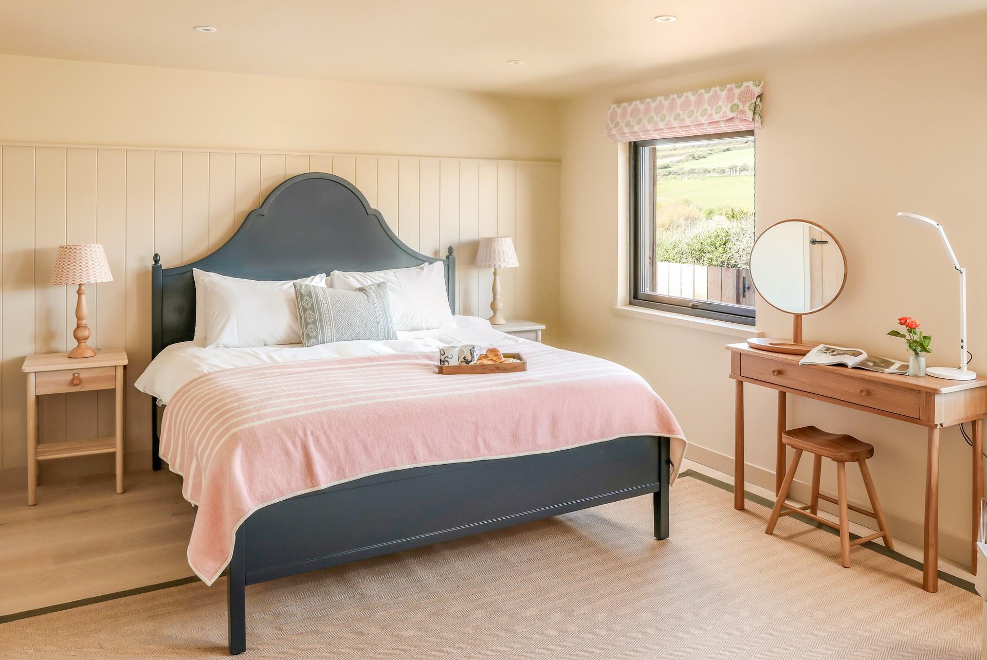 The master bedroom is spacious and beautifully decorated.