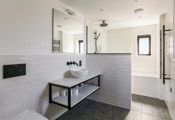 The bathroom has a separate shower head for washing sandy toes.