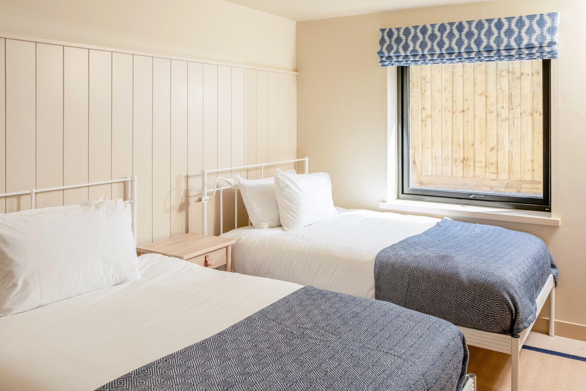 Bedroom 1 features small double beds.