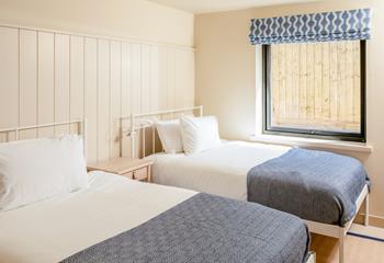 Bedroom 1 features small double beds.