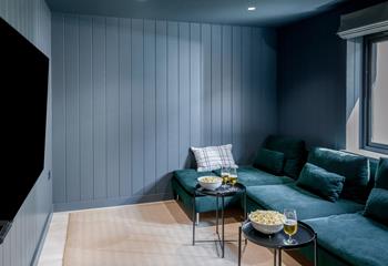 Sink into the plush velvet sofas with your favourite movie on the TV.