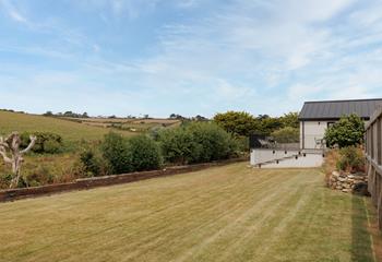 The large lawn is the perfect place to catch some rays. 