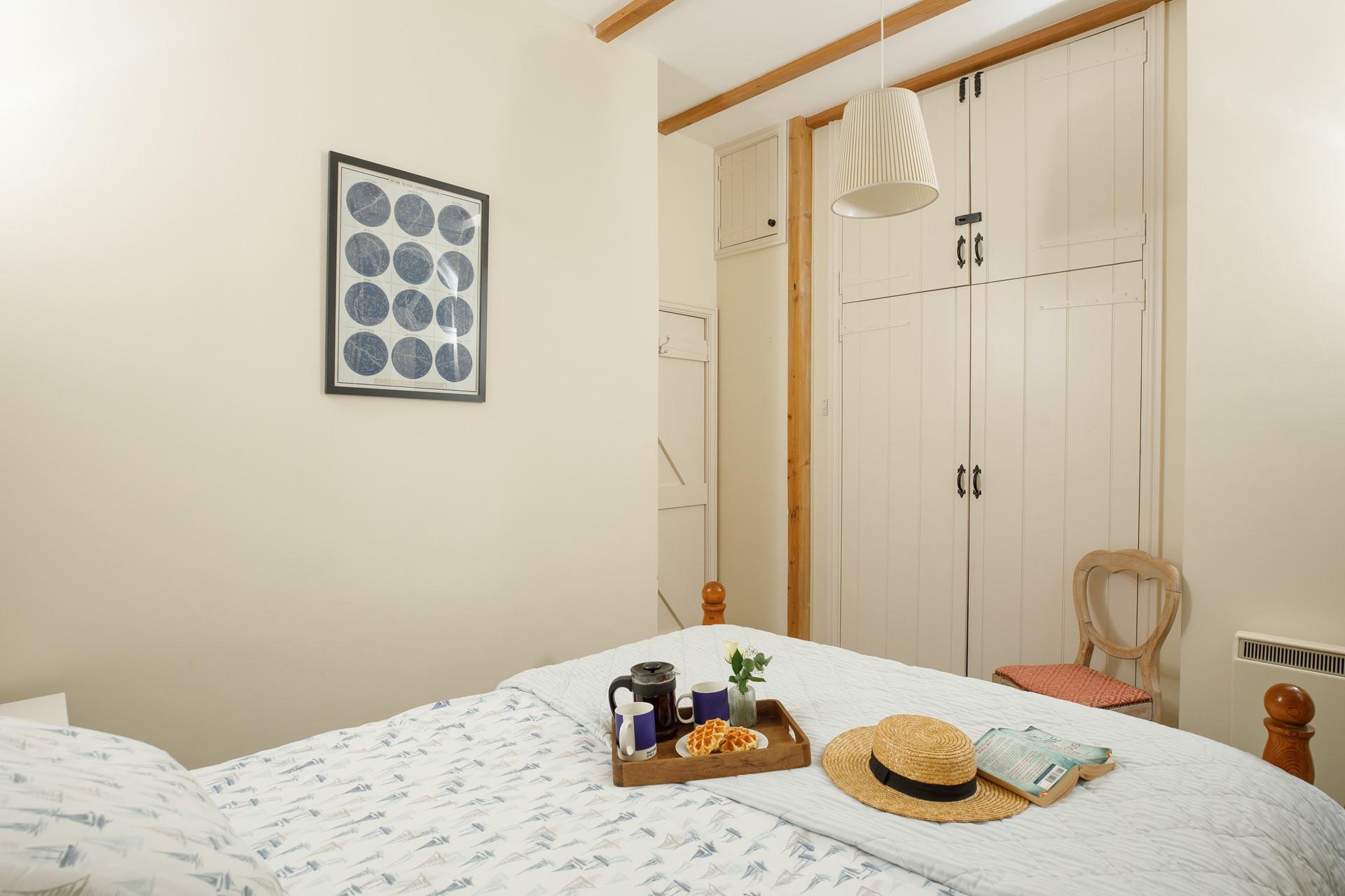 Bedroom 1 has a double bed and a Juliet balcony.