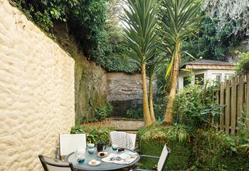 Escape to the tranquil split-level garden for an afternoon cuppa.