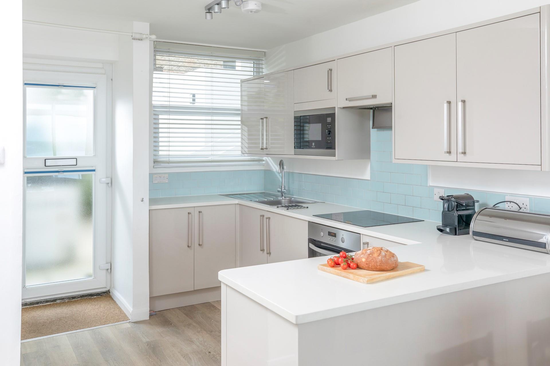 The kitchen is modern and well-equipped.