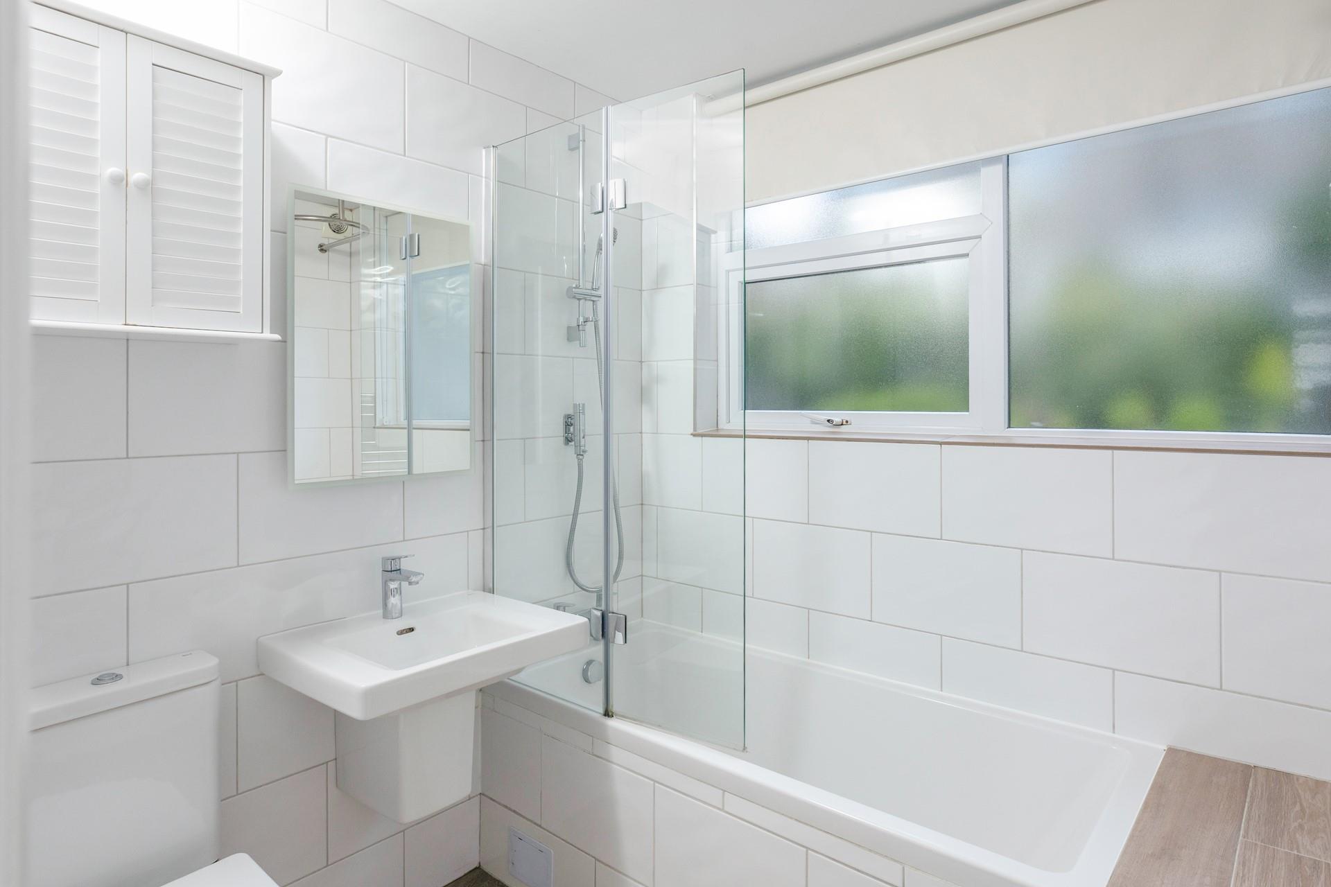 The family bathroom is modern and ideal for getting ready for the day.