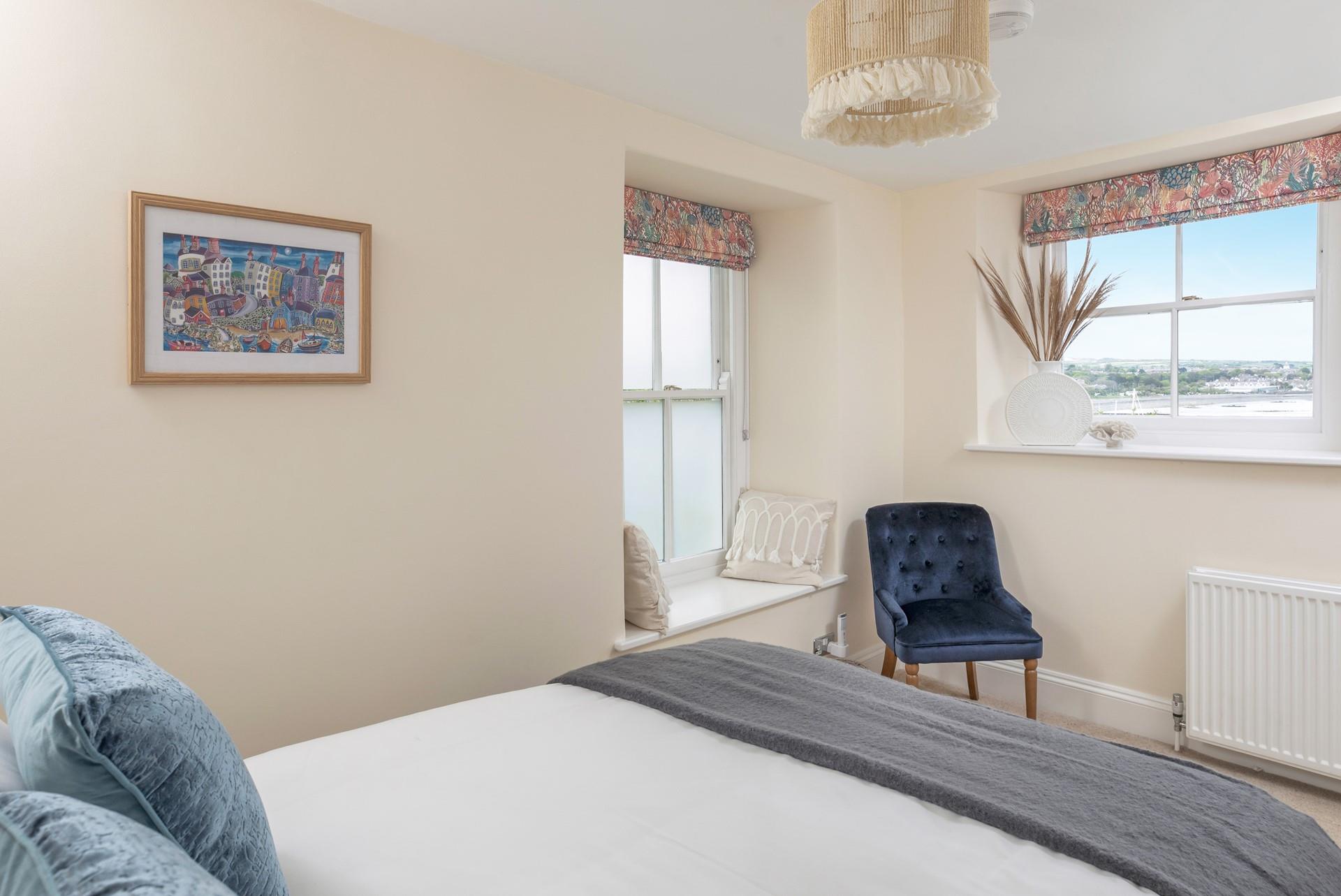 Bedroom 3 is decorated with coastal colours.