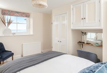 Wake up to beautiful sea views in the bedroom.
