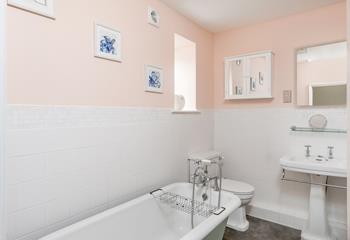 Unwind in the bubbles in the luxurious roll top bath.