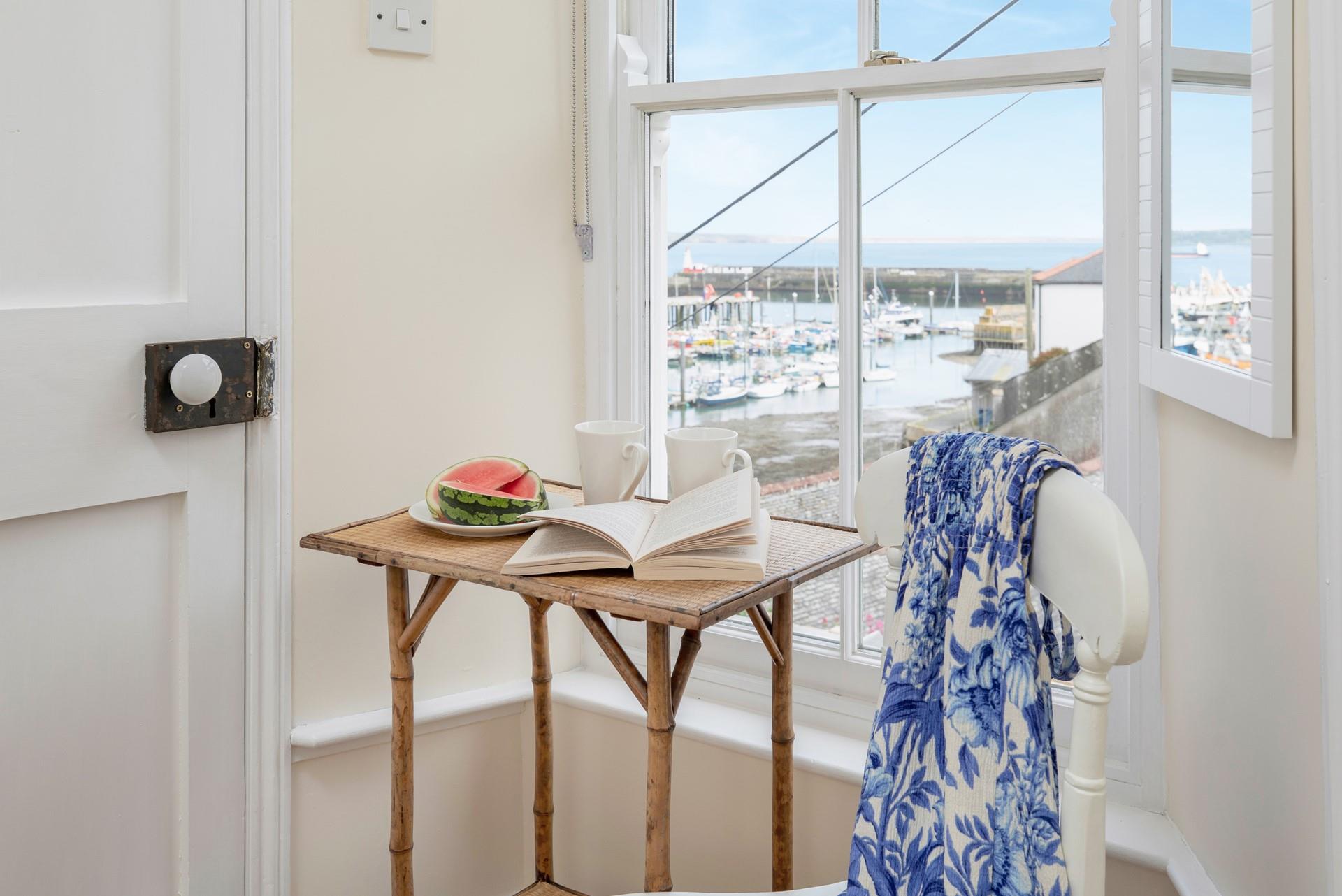 Watch the boats bobbing on the water on a calm summer morning.