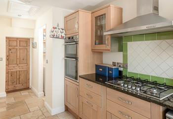 The kitchen is fully equipped for cooking.