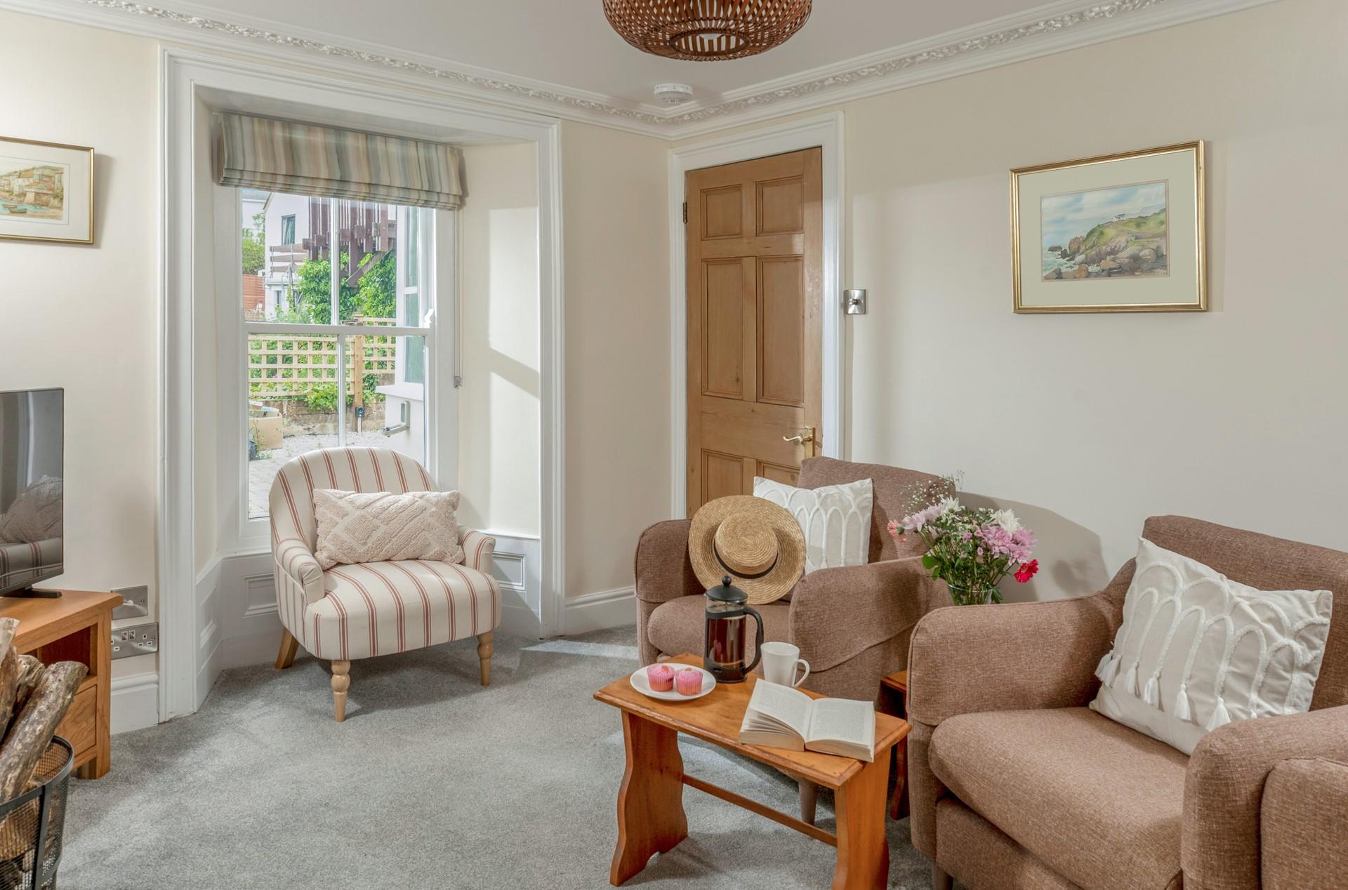 There is plenty of comfortable seating in the sitting room.