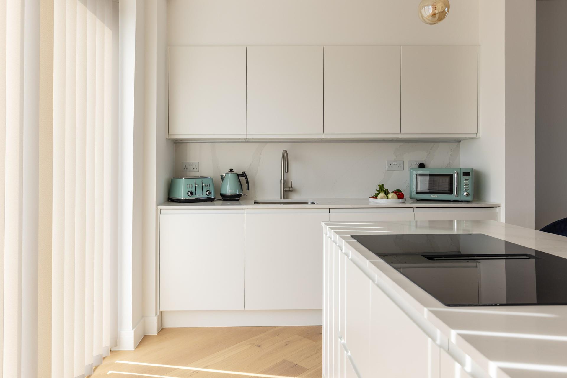 Sleek and compact, the kitchen area makes cooking holiday meals a dream.