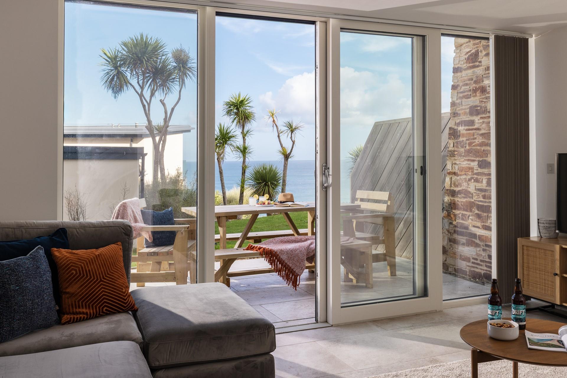 From the ground floor sitting room, step onto the sea-facing patio!