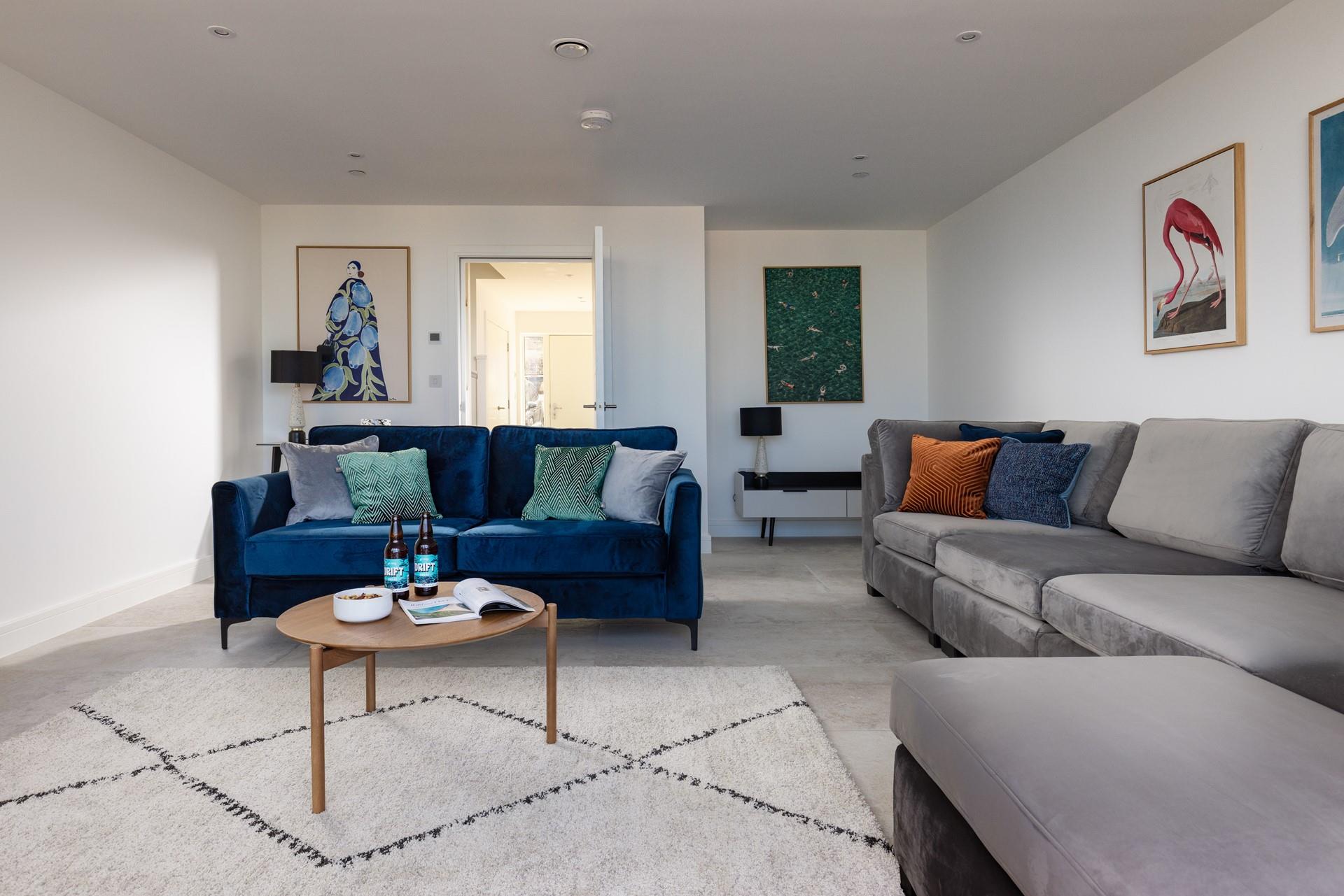 Relax in style in the ground floor sitting room's luxurious furnishings.