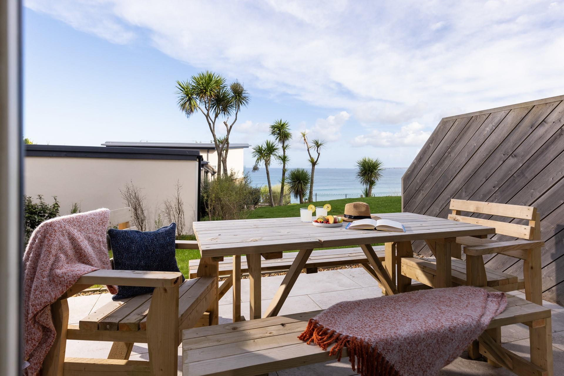 Unwind on the patio, overlooking the ocean. The perfect sundowner spot!