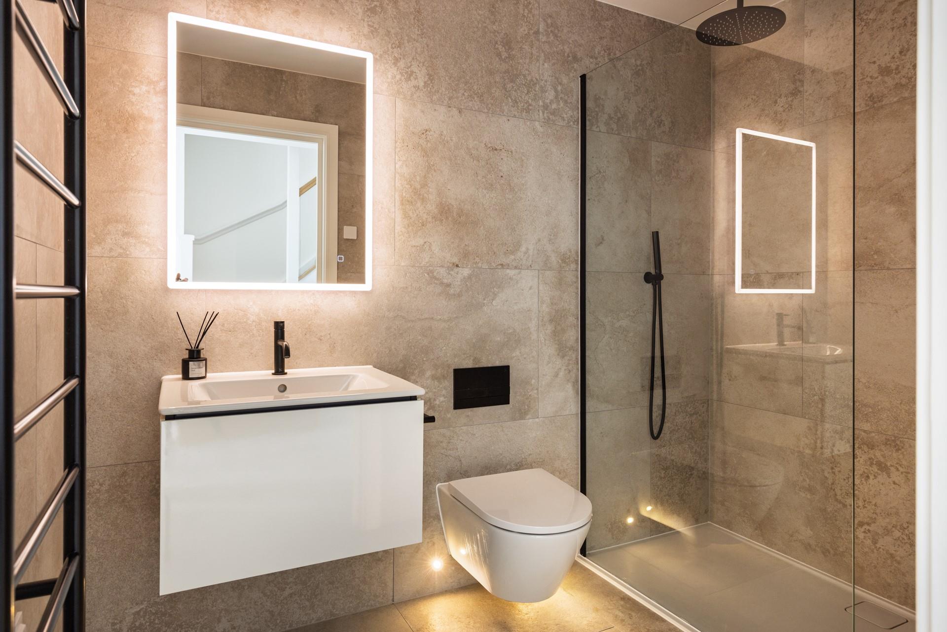 Each bathroom has  a spa-like feel with modern amenities.