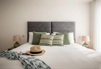 Sink into bed and drift off to sleep in bedroom 2.