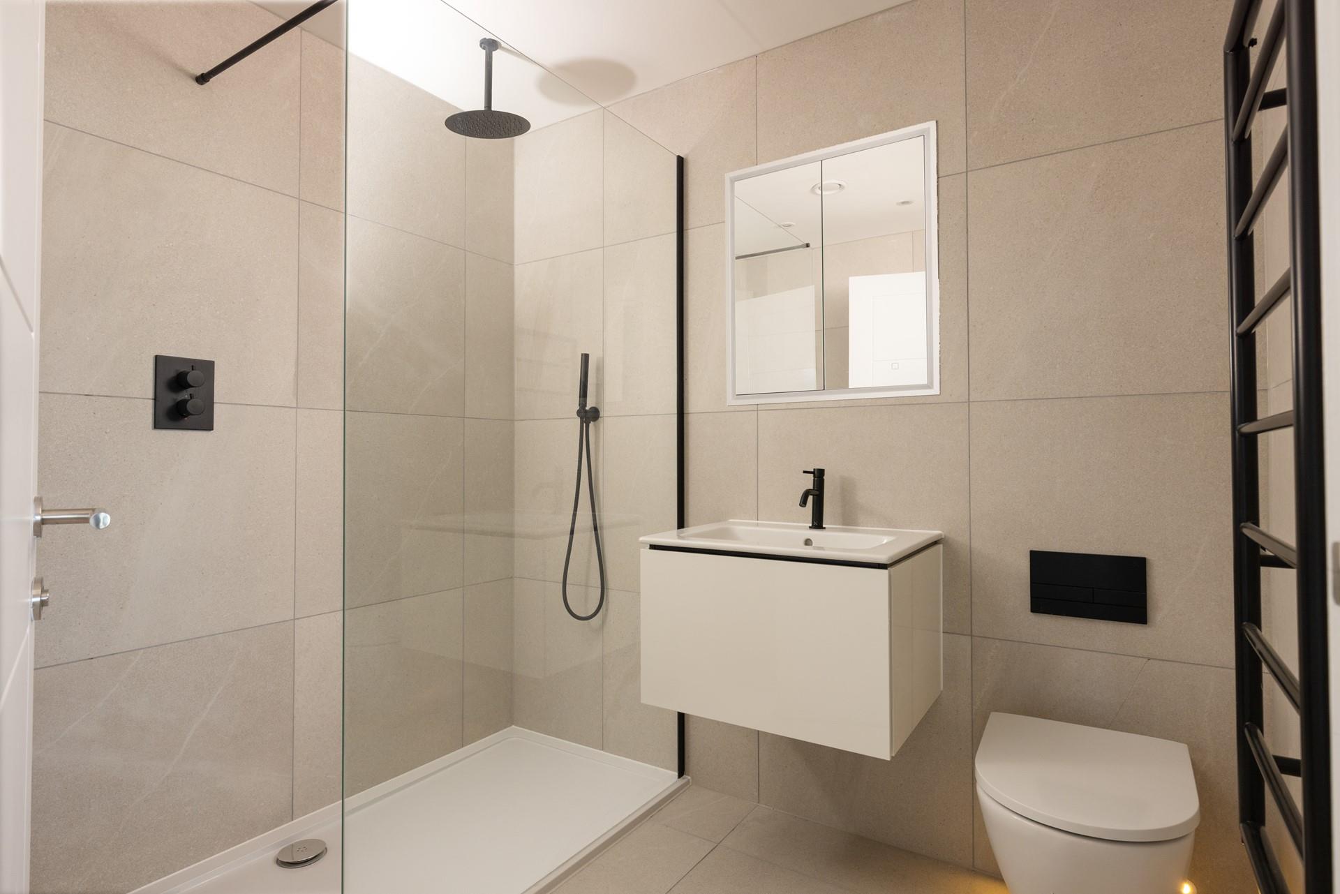 Wash off the sand in the walk-in shower after a day at the beach. 