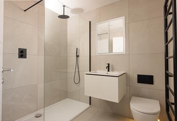 Wash off the sand in the walk-in shower after a day at the beach. 