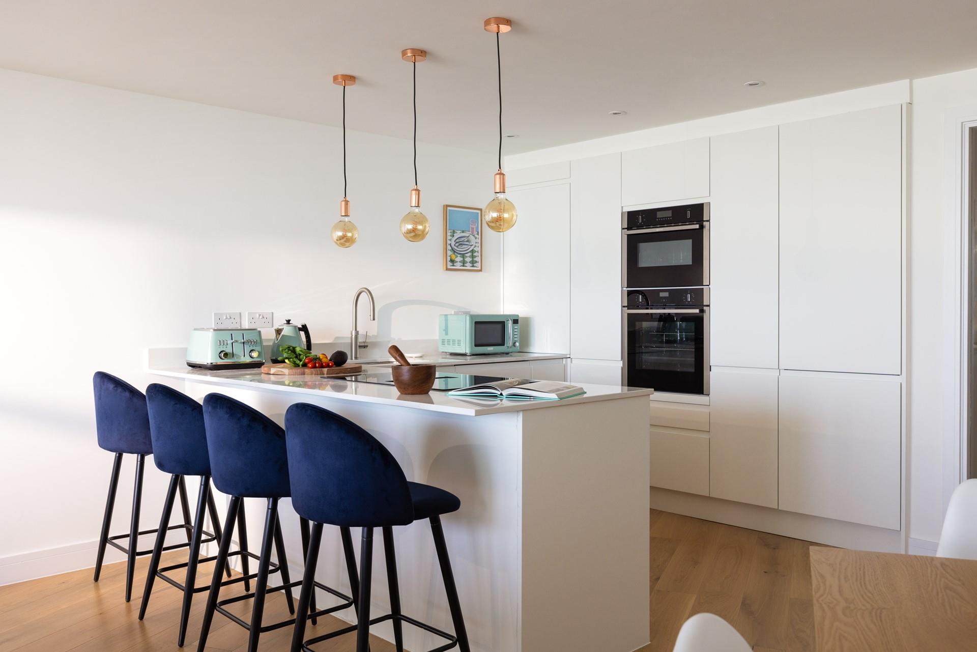 Overlooking the ocean, the kitchen is perfect for rustling up your favourite meals. 