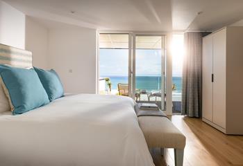 Bedroom 1 benefits from ocean views and modern decor.