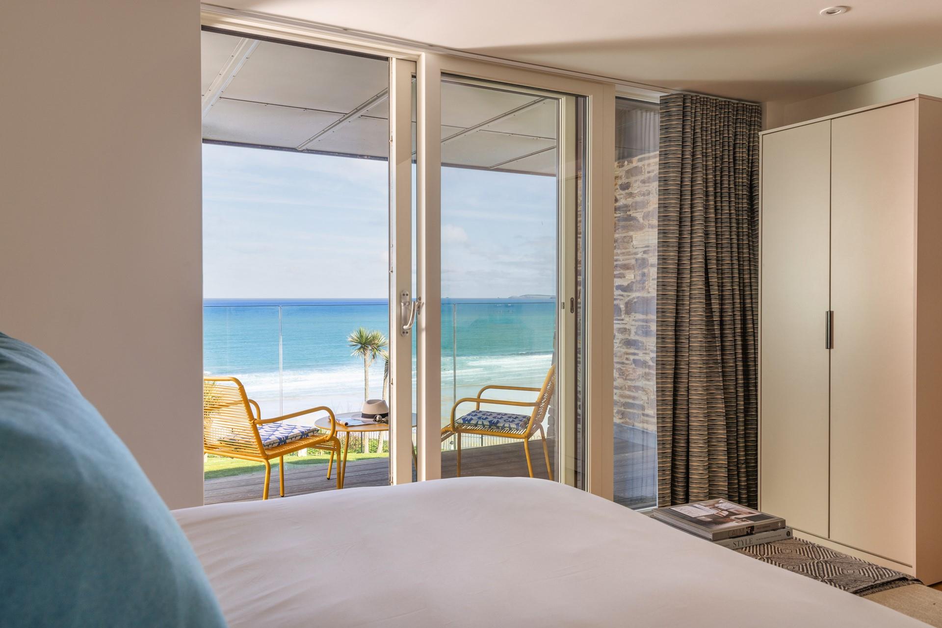 Step from the comfort of the sumptuous bed and into the balcony.