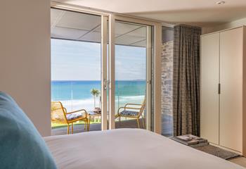 Step from the comfort of the sumptuous bed and into the balcony.