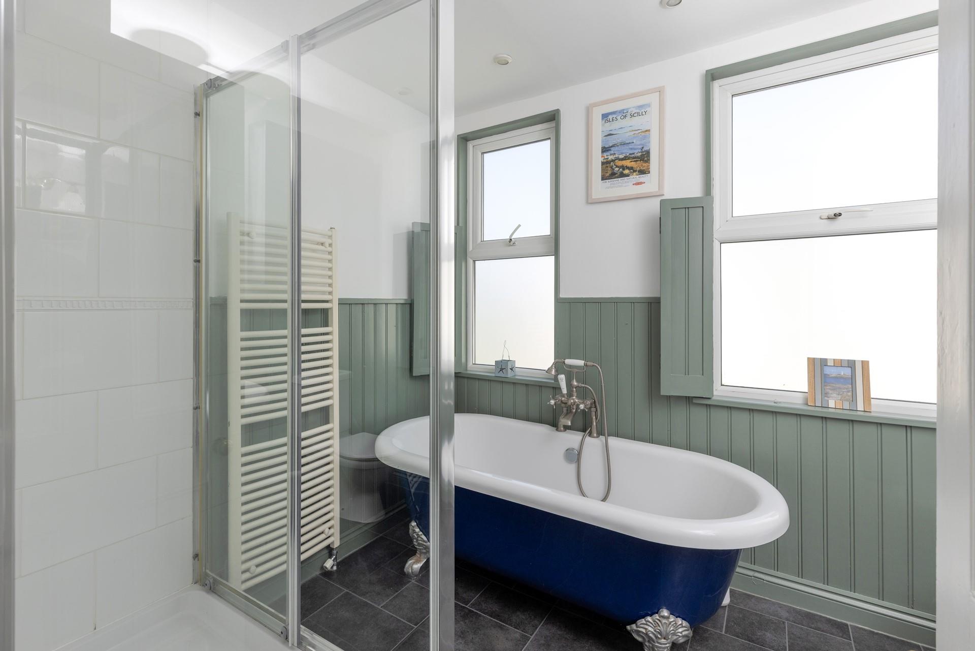 The luxurious bath offers a relaxing soak.