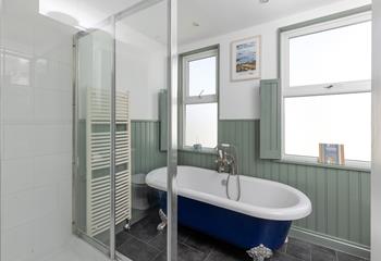 The luxurious bath offers a relaxing soak.