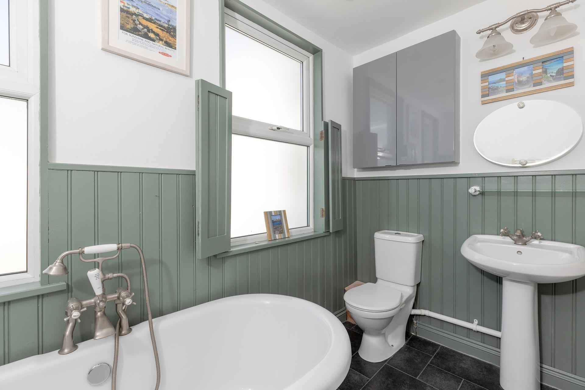 The family bathroom is ideal for freshening up after a day on the beach.