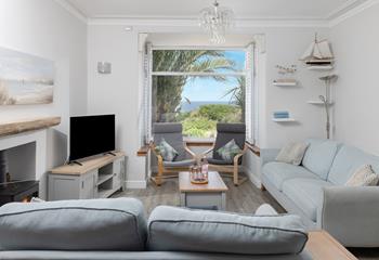 Enjoy sea views from the cosy sitting room at Trevarno.