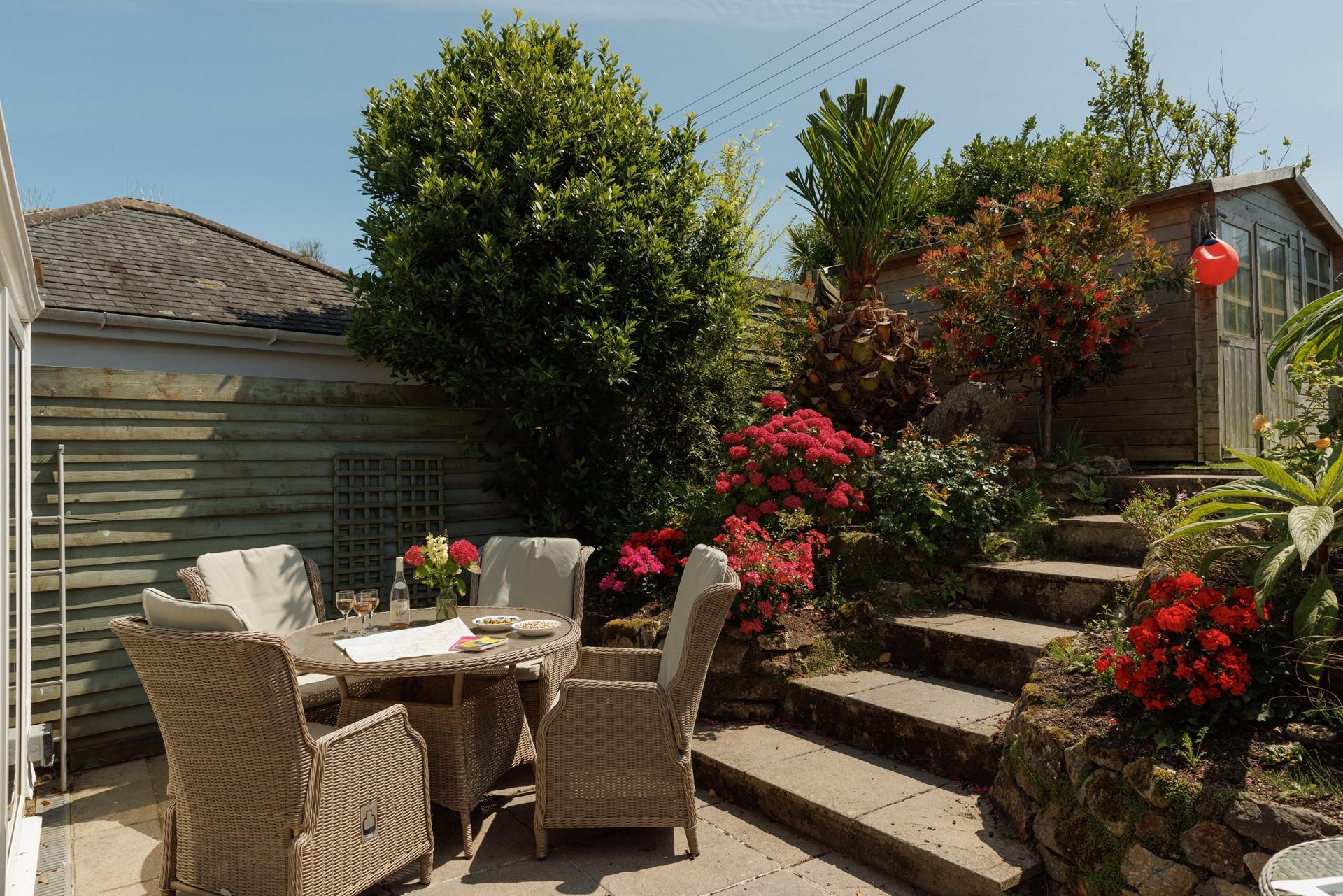 Take meals outside to the blooming garden.