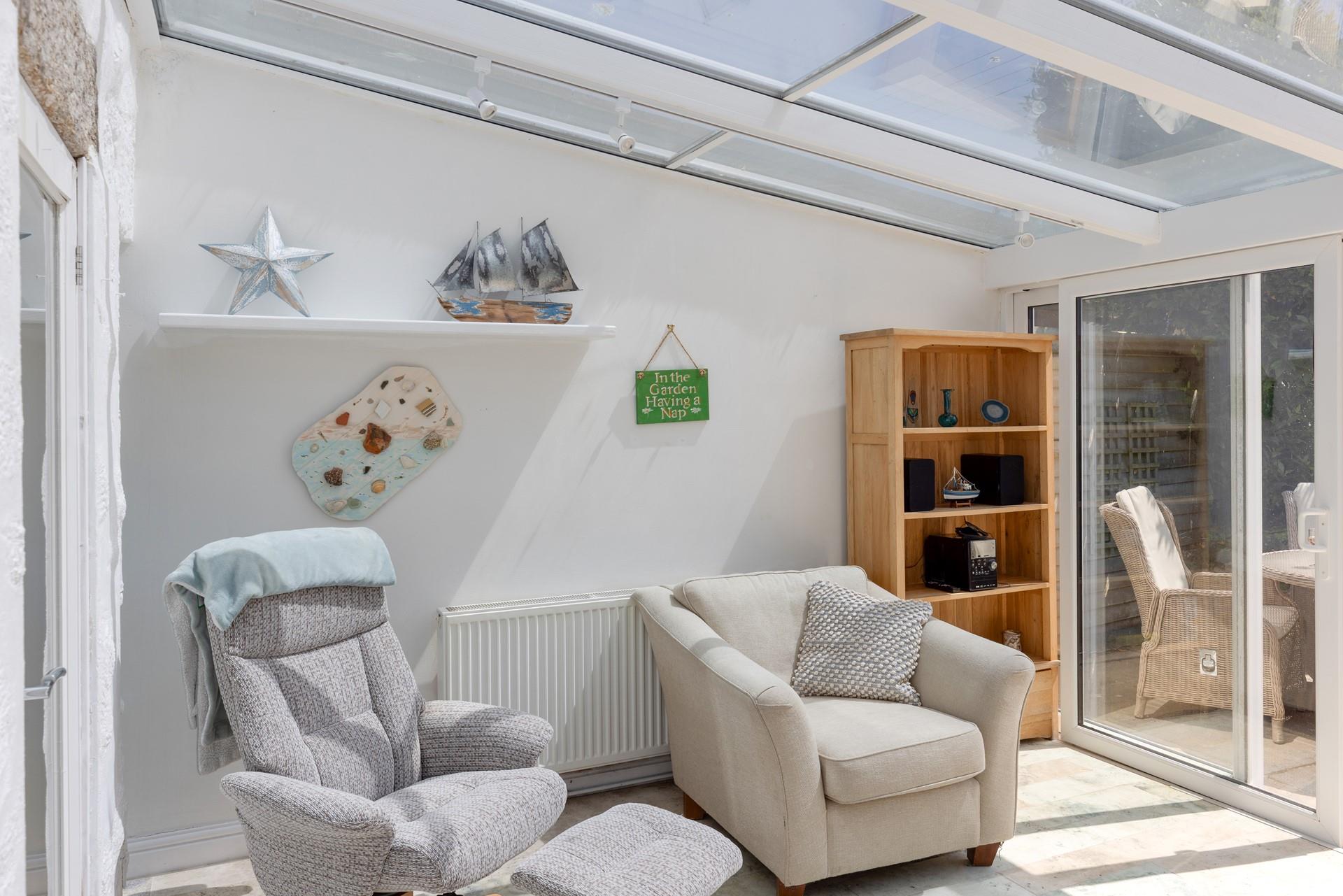 Spend the day on the beach and relax for the evening in the conservatory.