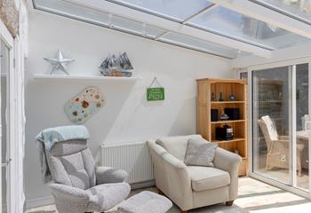 Spend the day on the beach and relax for the evening in the conservatory.