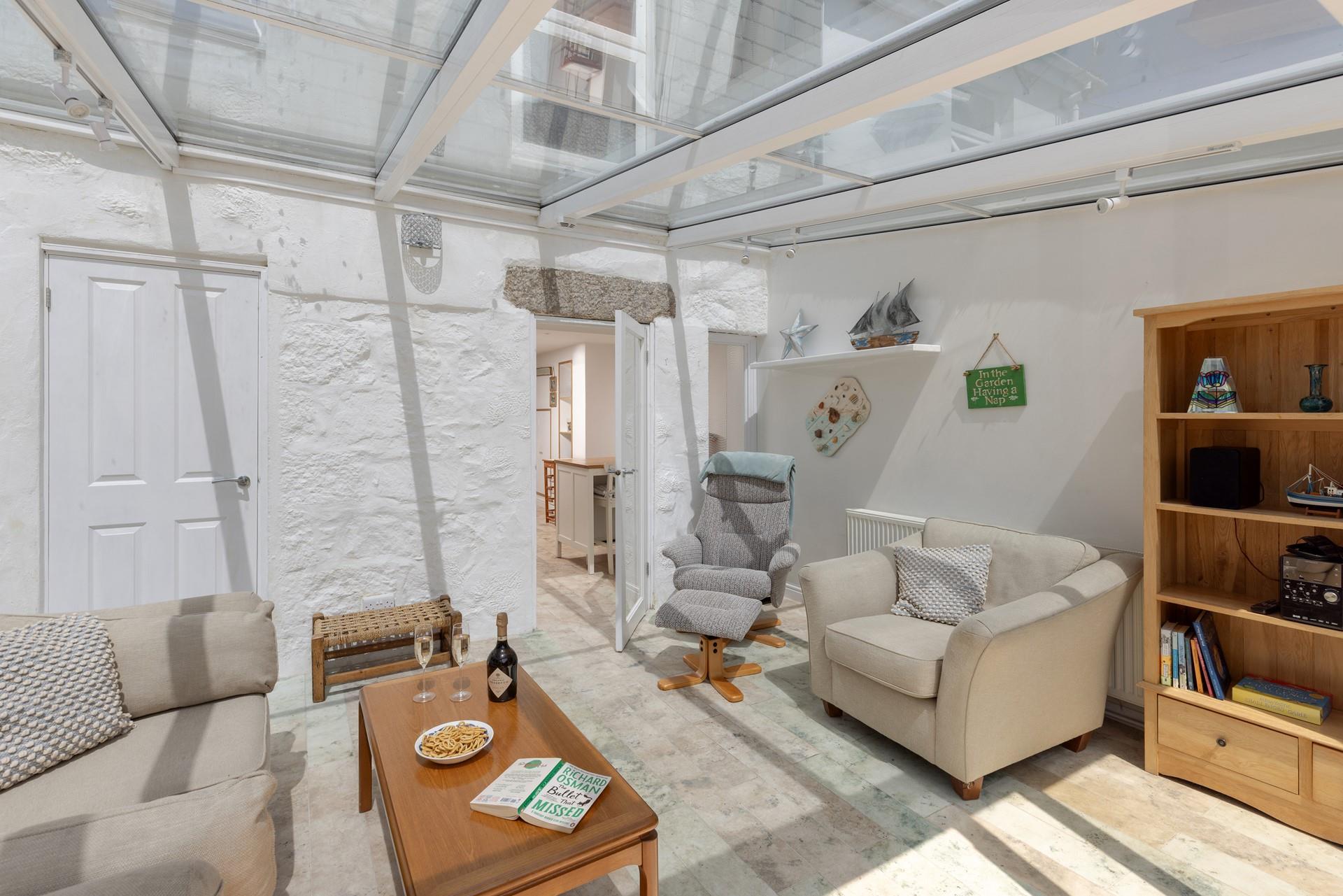 The conservatory is an additional space to unwind.