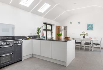 The sleek kitchen has all the mod cons you need.
