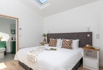The light and bright ground floor bedroom has a chic en suite.