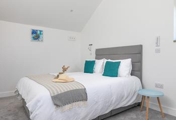 Soft white sheets await as you take a break from the hustle and bustle of daily life.