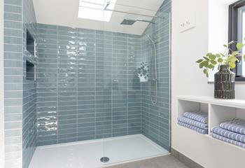 Step into the large rainfall shower for a refreshing start to the day!