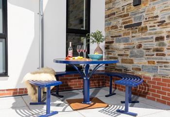 Dine al fresco around the patio table.