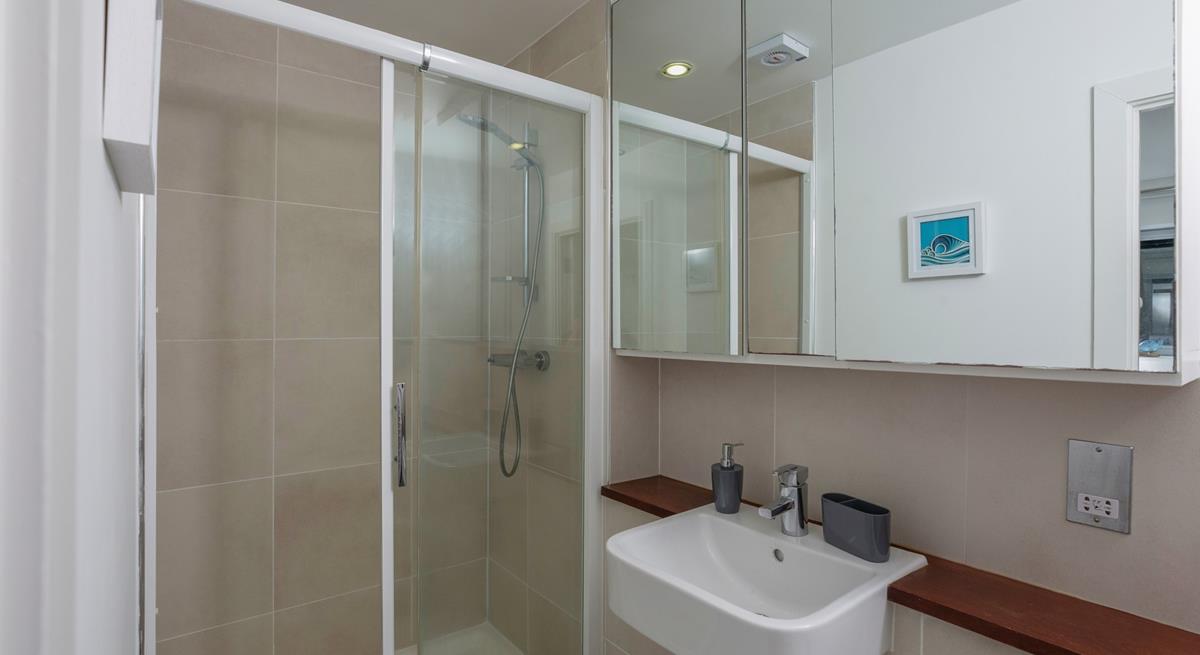 Wash off sandy toes in the shower.