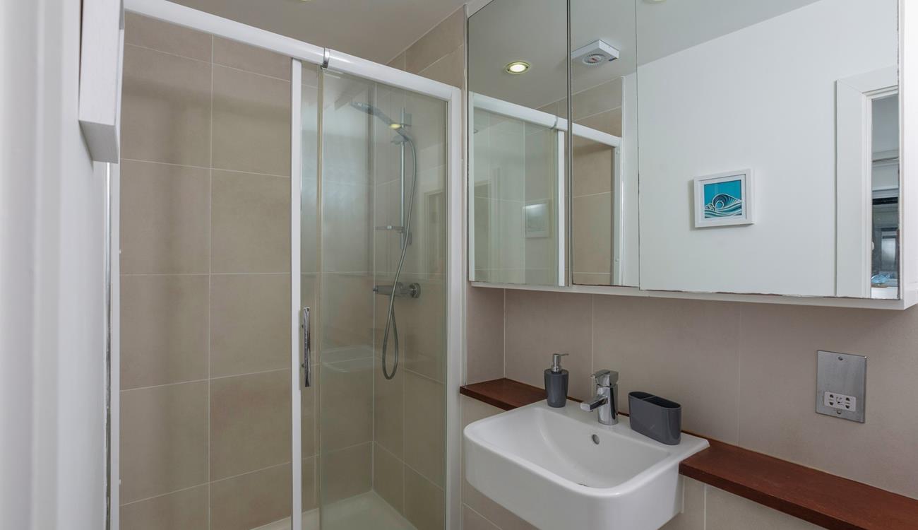 Wash off sandy toes in the shower.