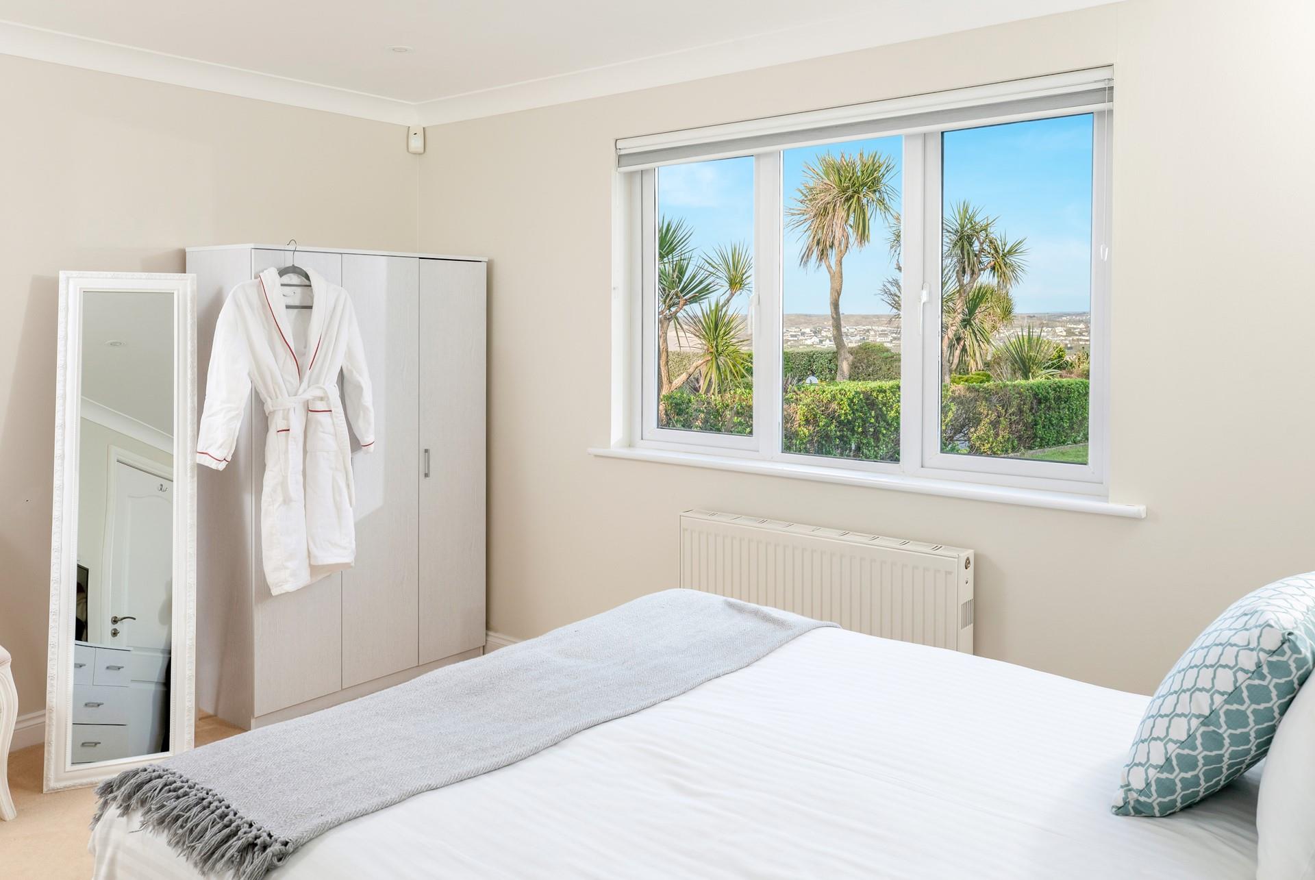 Soft sheets and robes await in the peaceful bedrooms.