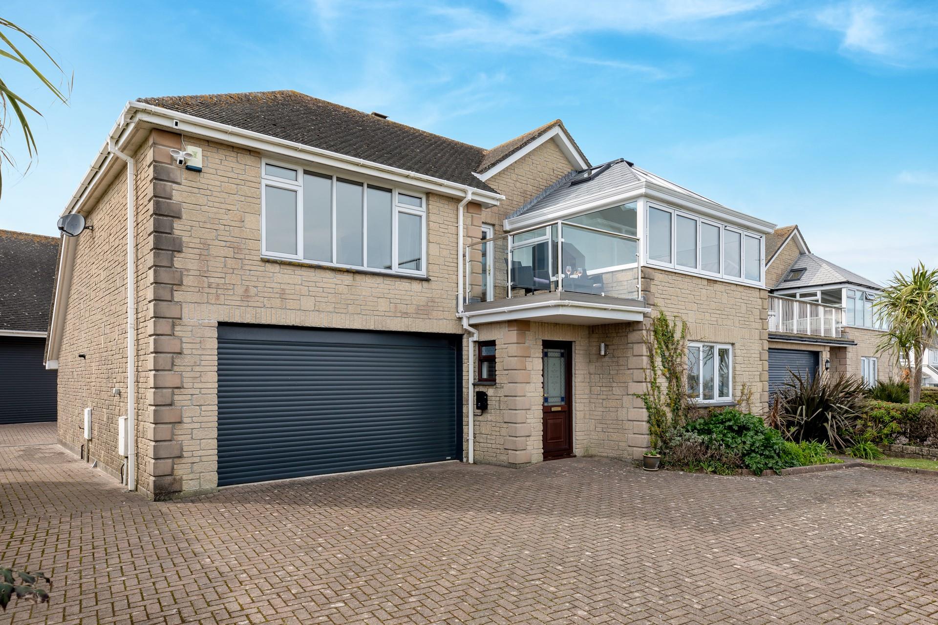 The driveway has plenty of space for multiple cars.