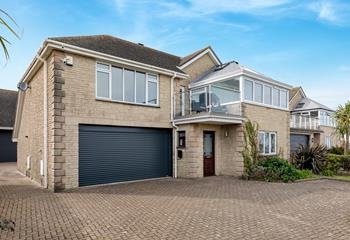 The driveway has plenty of space for multiple cars.